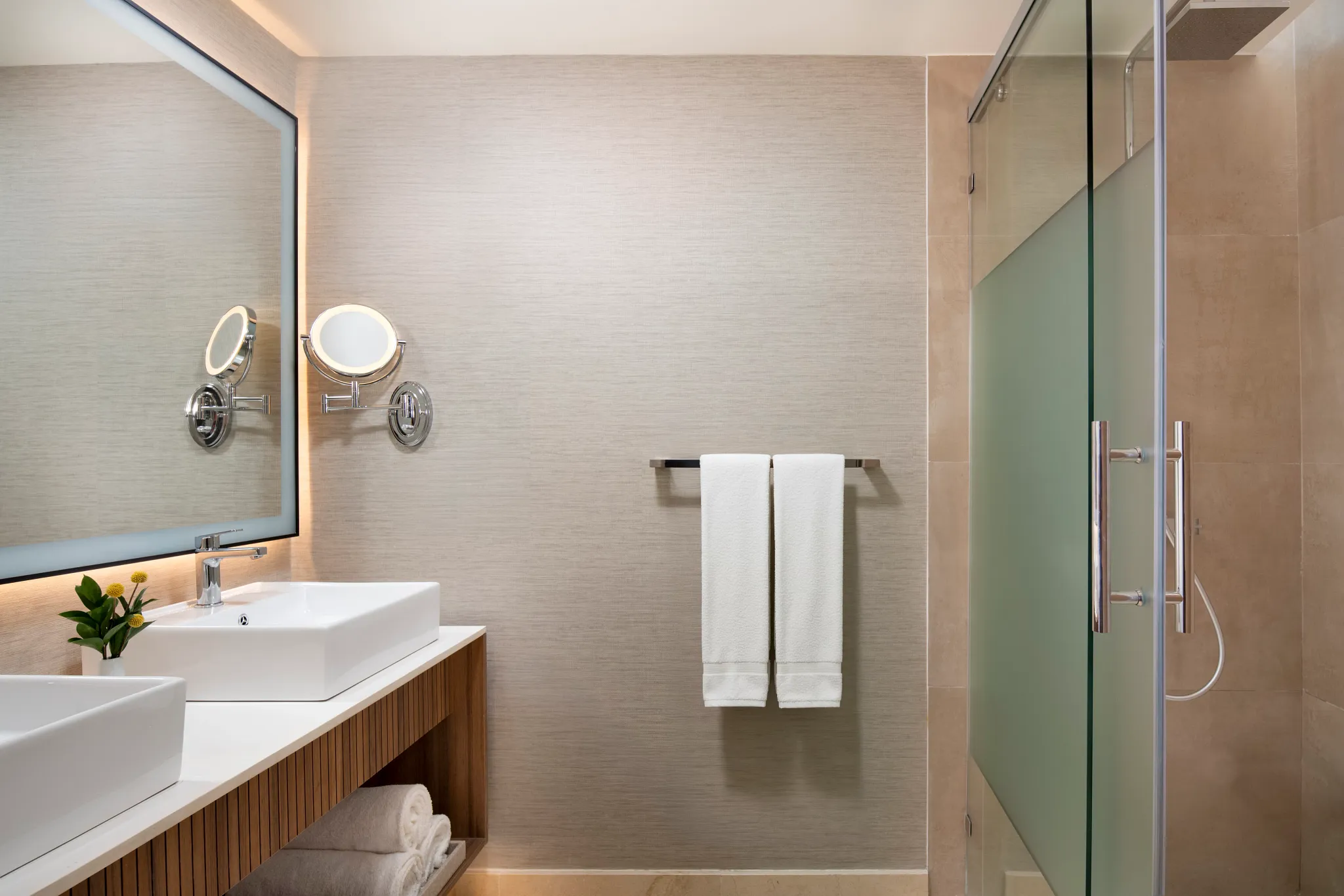 Vantage Club Garden View bathroom with double vanities and glass shower at Hyatt Vivid Punta Cana.